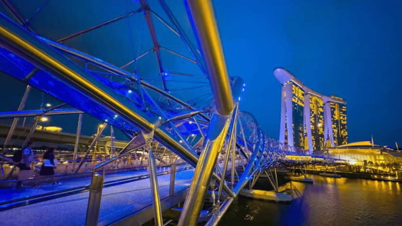 Singapore: Sunset River Cruise and Glittering Light Shows - Clarke Quay river cruise: skyline views with a guide in your ear